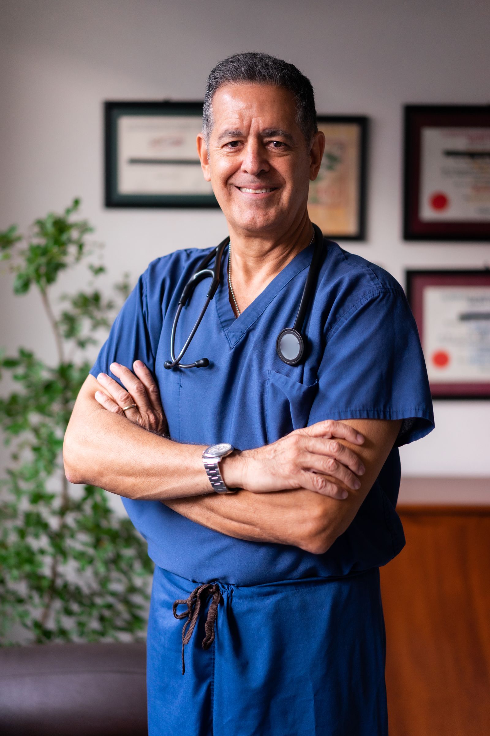 Portrait of Daniel Reyes in blue scrubs
